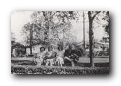 Lois and Bev on a bench with MRU and HCU 1946.jpg